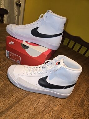 Nike White High-Top Sneakers with Black Swoosh